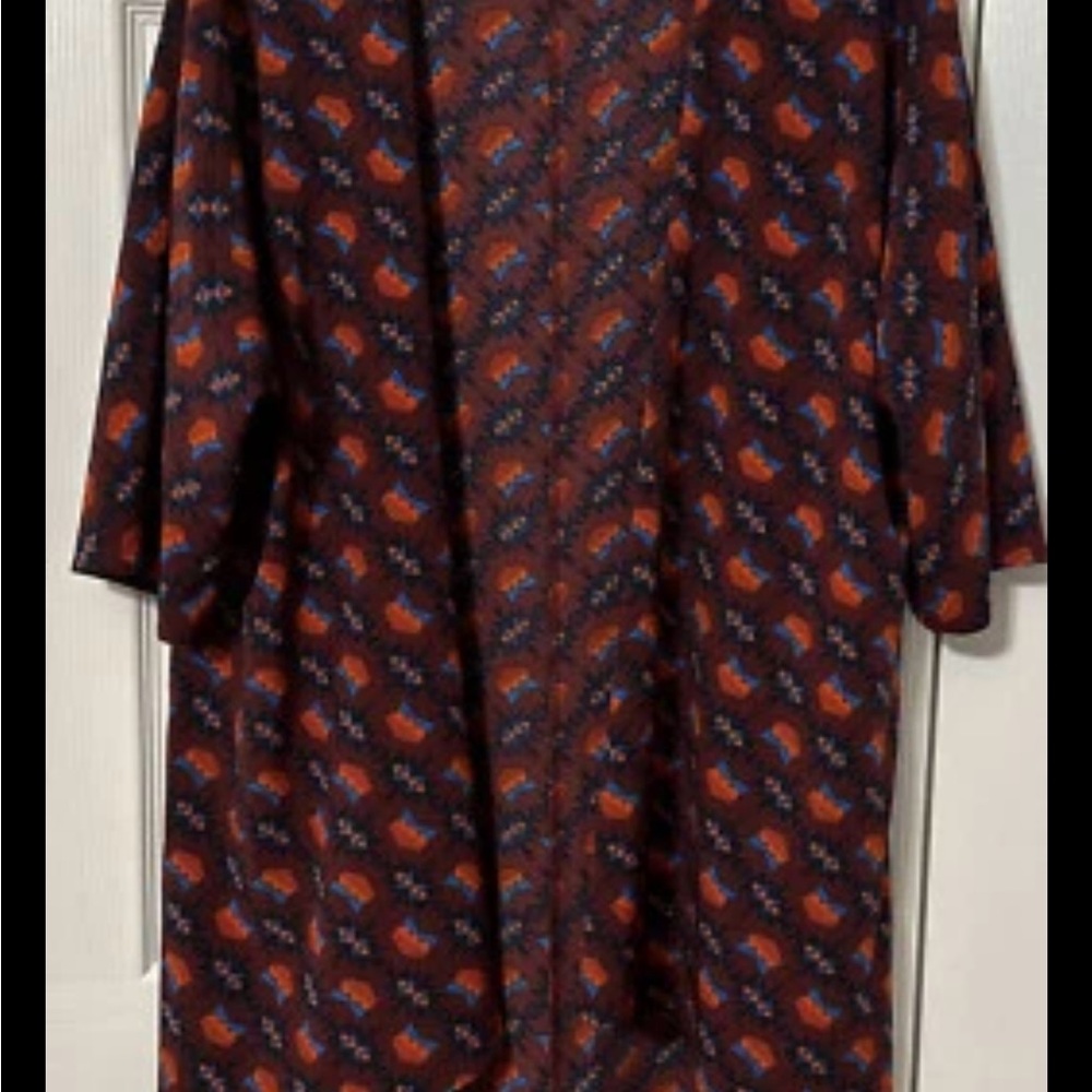 NWOT LuLaRoe kimono size small. Never worn.